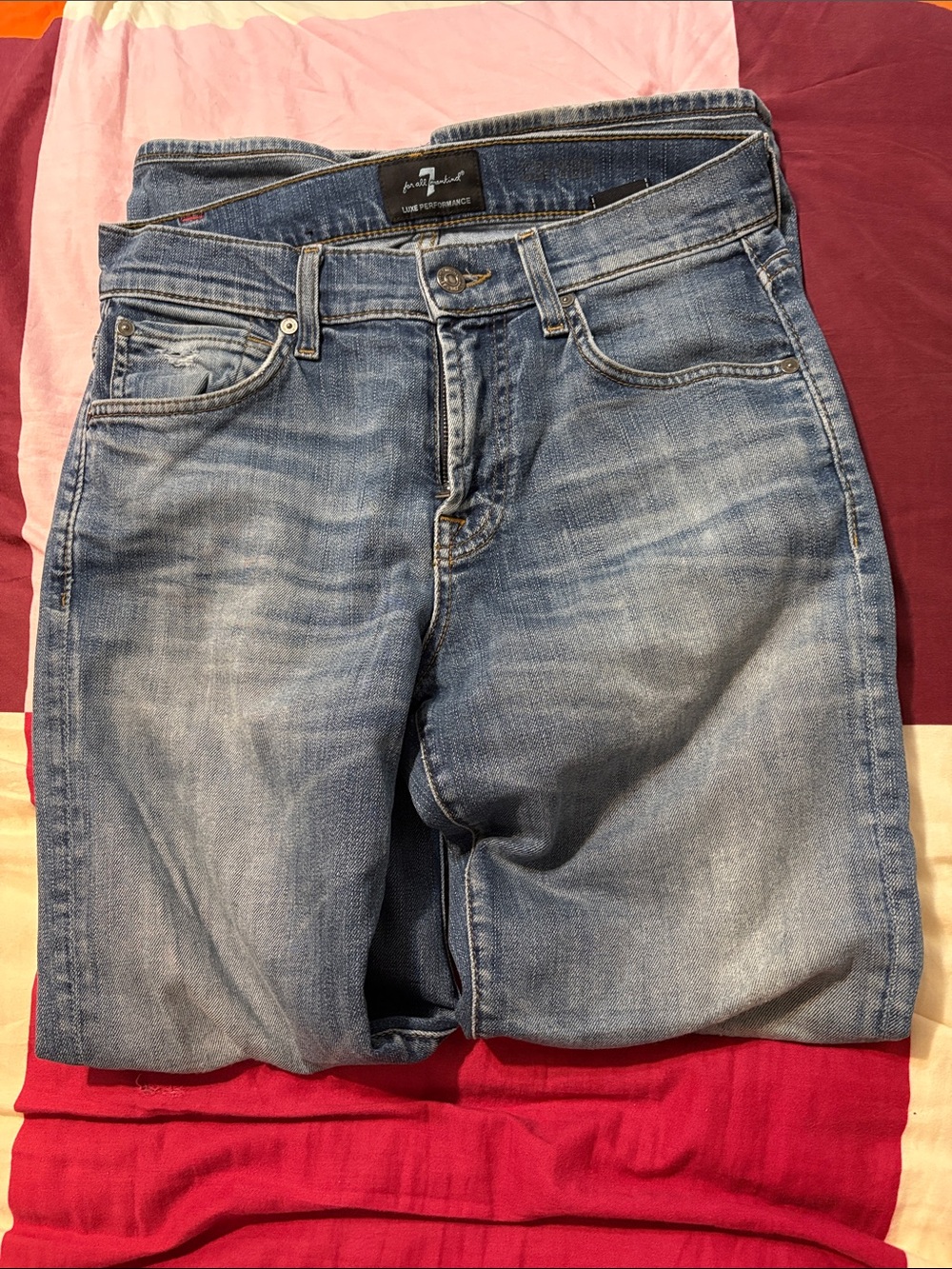 7 For All Mankind Light Blue Bootcut Jeans with Faded Detailing